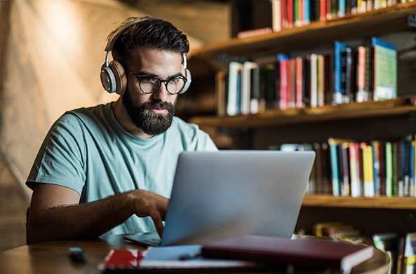 Man sitting at computer using TELI software.